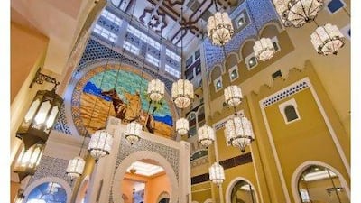 A mural of the Arab adventure Ibn Buttuta dominates an interior view of the Ibn Battuta Gate Movenpick Hotel. Charles Crowell for The National