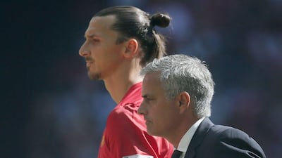 Manchester United manager Jose Mourinho, right, with Manchester United's Zlatan Ibrahimovic during the Community Shield soccer match between Leicester and Manchester United at Wembley stadium in London, Saturday April 9, 2016. (AP Photo/Tim Ireland)