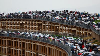 Visitors stand on the Grand Ring, the largest wooden architectural structure according to Guinness World Records, on Expo 2025's first day which is open to the public, in Osaka, western Japan April 13, 2025. REUTERS / Issei Kato TPX IMAGES OF THE DAY