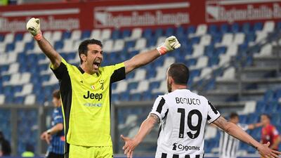 Juventus' Gianluigi Buffon with Leonardo Bonucci. Reuters