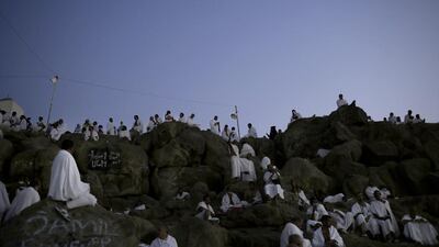 From a distance, the hill appeared a snowy white, as male pilgrims wear a seamless two-piece white garment, ihram. Nariman El-Mofty / AP Photo
