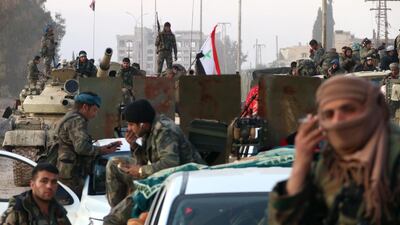 Syrian army soldiers advance on a road in the northern Aleppo countryside. AFP