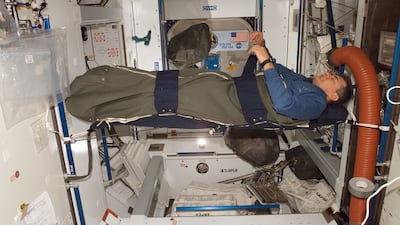 Italian astronaut Paolo Nespoli rests in his sleeping bag onboard the International Space Station in 2017. Photo: Nasa