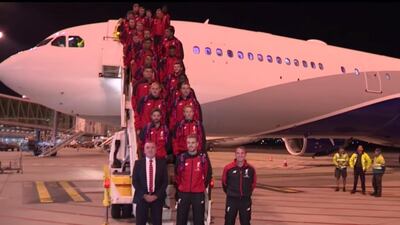 In this screenshot from YouTube, the Liverpool squad disembark from the plane after landing in Adelaide.