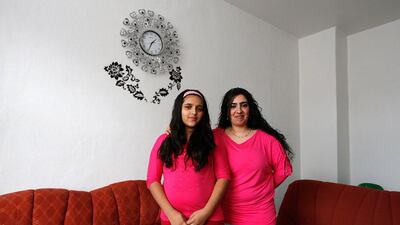 Bulgarian migrant Ayshe Kakarmustafa, 33, and her daughter Neriman, 11, at their home in Dortmund, Germany. Ayshe finished school at 14 and worked in a shoe factory in Bulgaria and as a young girl she wanted to become a hairdresser. Ayshe hopes that her daughter Neriman will do whatever she wants when she grows up. Neriman would like to become a doctor. Ina Fassbender / Reuters