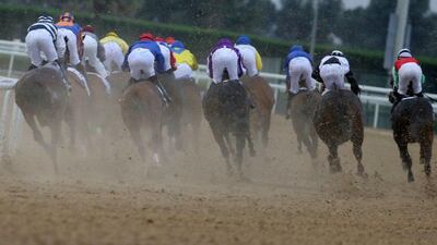 Jockies ride in the UAE derby at the Dubai World Cup in the Meydan Racecourse on March 25, 2017 in Dubai. Karim Sahib / AFP