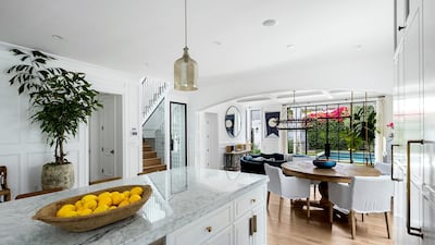 The property has six bathrooms, a separate dining room, a walk-in wine cellar, a dog or cat room built-in with a separate entry door and an open-plan kitchen with an adjoining living area. Courtesy Engel & Volkers