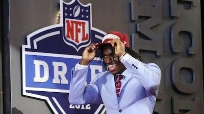 Robert Griffin III walks on stage after he was selected as the second pick overall.