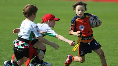 The Arabian Knights’ offender carries the ball for a run at the goal, escaping the grasp of AD Harliquinn defenders during game action on Friday, January 22, 2016, at the HSBC Rugby Festival Dubai. DELORES JOHNSON / The National