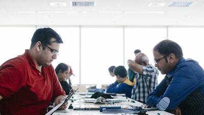Nikhil Soneja and Sayyad Yasir Jamshaid compete in the two-day scrabble tournament organised by the UAE Scrabble Club at International Horizons College in Business Bay, Dubai. Rebecca Rees for The National
