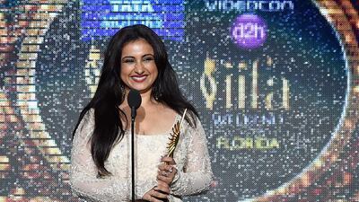 Bollywood actress Divya Dutta receives the award for Best Performance in a Supporting Role. Jewel Samad / AFP