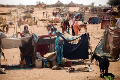 Women and children outside their tent at the Zamzam camp, where half a million people have taken shelter. AFP
