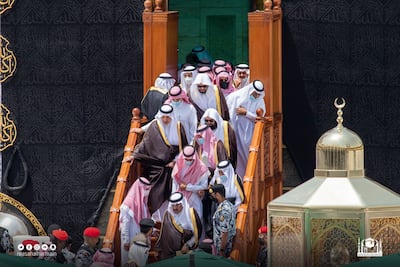 Saudi Arabia's Prince Khalid Al Faisal, the governor of Makkah, arrives to clean the Holy Kaaba.
