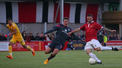Tom Greaves of FC United takes a shot during the friendly against Benfica at Broadhurst Park on May 29, 2015, in Moston, England. Getty