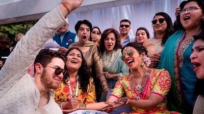 Priyanka Chopra and Nick Jonas celebrate during a mehendi ceremony, a day before their wedding, at Umaid Bhawan in Jodhpur, India. Photo: Raindrop Media via AP