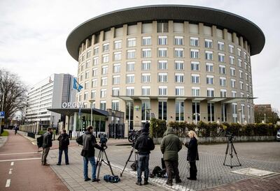 Journalists wait outside the headquarters of the Organisation for the Prohibition of Chemical Weapons in The Hague, The Netherlands. EPA