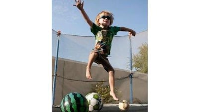 For the cystic fibrosis sufferer Noah Wilson, 5, fun is serious business. Jumping on a trampoline loosens the mucus in his lungs. Duncan Chard for The National