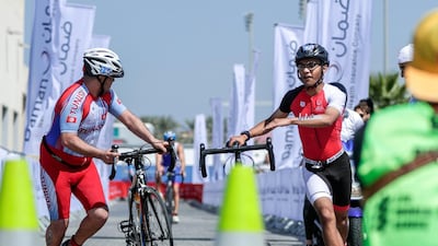 Special Olympics ITU Traiathlon at the YAS Marina Circuit. Micah Hambleton finishes the bike stage. Victor Besa / The National