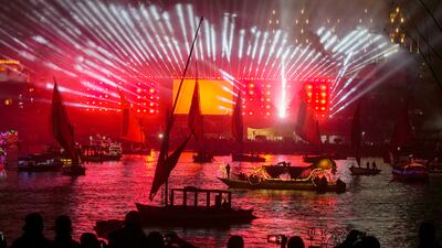 People take boat tours on the Nile River past New Year decorations as celebrations begin in Cairo. AP Photo