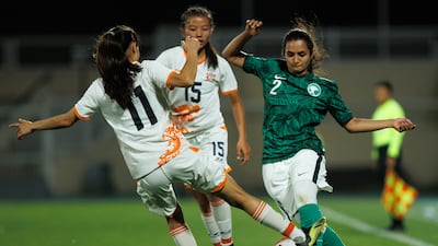 Saudi Arabia's Bayan Sadagah, right, during a friendly against Bhutan at the Prince Sultan bin Abdulaziz Stadium in 2022. AFP