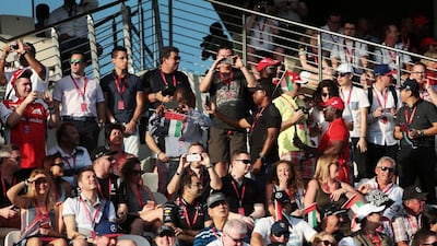 Fans wait for the start of the Abu Dhabi Formula One Grand Prix at Yas Marina Circuit in Abu Dhabi on November 27, 2016. Christopher Pike / The National