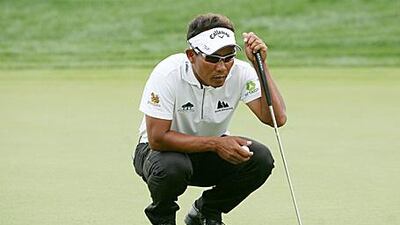 Thongchai Jaidee lines up a putt on the fifth hole yesterday. He finished the day three-under par.