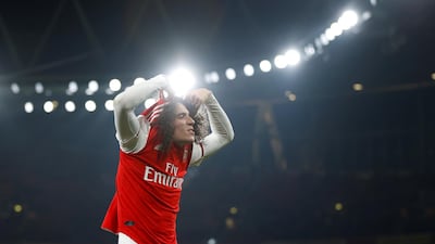 Arsenal's Matteo Guendouzi takes his shirt off after the match. Reuters