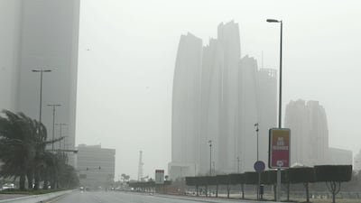 Dusty and windy conditions along Abu Dhabi Corniche. Khushnum Bhandari for The National