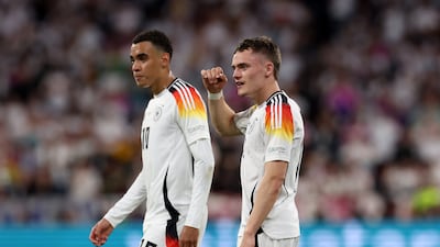 Jamal Musiala, left, and Florian Wirtz of Germany celebrate the win over Scotland. Getty Images