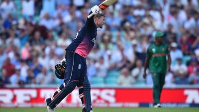 Joe Root celebrates reaching his century for England during the Champions Trophy win against Bangladesh. Glyn Kirk / AFP