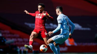 Liverpool's Trent Alexander-Arnold and Burnley's Dwight McNeil battle for the ball. PA