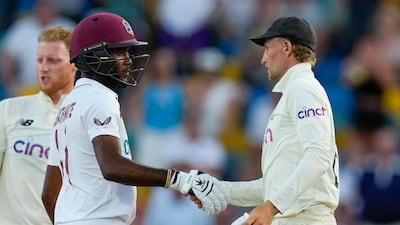 England captain Joe Root, right, shakes hands with West Indies' counterpart Kraigg Brathwaite at the end of day five of the second Test match at the Kensington Oval in Bridgetown, Barbados. AP Photo