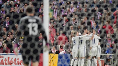 Real Madrid players celebrate after Cristiano Ronaldo opened the scoring. Pierre-Philippe Marcou / AFP