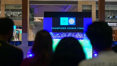 Fans at Yas Mall in Abu Dhabi watch Manchester City beat Inter Milan to win the Champions League final. Khushnum Bhandari / The National