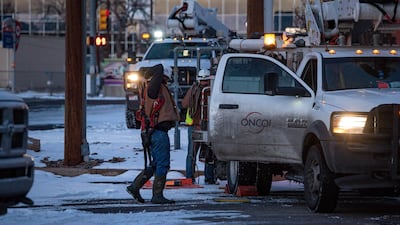 Oncor apprentice lineman Brendan Waldon gets ready to repair a damaged utility pole after a winter storm battered Texas. AP
