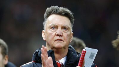 Manchester United manager Louis Van Gaal applauds after their Premier League 1-1 draw with Stoke City on Thursday. Darren Staples / Reuters / January 1, 2015