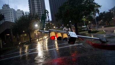 A damaged stop light blocks a street as Hurricane Harvey makes landfall in Corpus Christi, Texas. Nick Wagner / Austin American-Statesman via AP