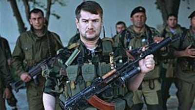 Colonel Sulim Yamadayev, centre, seen with his fighters from the Special Force 'Vostok' battalion in May 2005 in Gudermes, Chechnya.