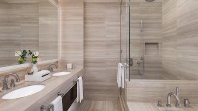 The bathroom in the Deluxe Room has a relaxing vibe