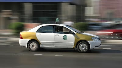 Six years ago, most of the taxis in Abu Dhabi were of the old white-and-gold variety rather than the professional fleet of silver taxis now. Photo: Philip Cheung / The National