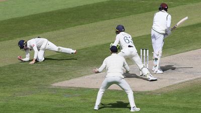 England fielder Ollie Pope catches out West Indies' Alzarri Joseph off the bowling of Dom Bess. Reuters