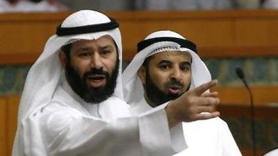 Kuwaiti MP Faisal Al Muslim, left, said the parliamentary panel has not accepted Sheikh Nasser's refusal to attend the hearing and a new summons has been issued for May 26.