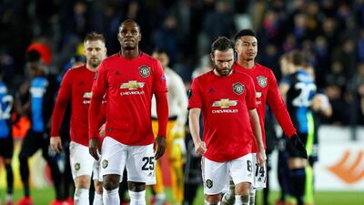 Manchester United's Juan Mata alongside Odion Ighalo and Jesse Lingard at the end of the match against Brugge. Reuters
