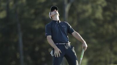 Justin Rose, of England, reacts after missing a birdie putt on the 18th hole during the final round of the Masters. Chris Carlson / AP Photo