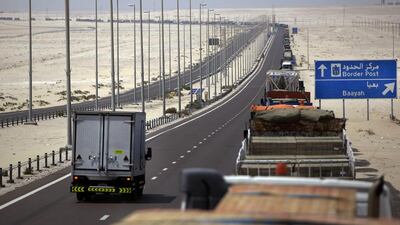 Above, lorries on the way towards the UAE-Saudi border at Ghuweifat. Paul O’Driscoll / The National