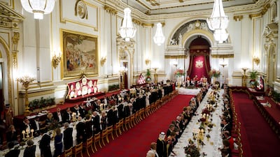 Guests are seated for the State Banquet at Buckingham Palace. PA