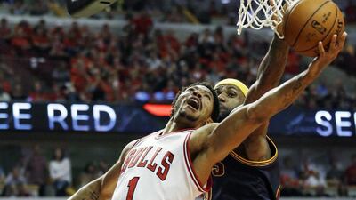 Derrick Rose, left, and the Chicago Bulls are making things difficult for LeBron James, right, and the Cleveland Cavaliers. Nam Y Huh / AP Photo
