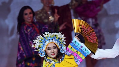 Miss China Li Peishan performs during the Miss World 2019 final in the ExCel centre in London. EPA