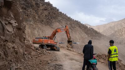 A digger clears a mountain road in Talat N'Yaaqoub. Getty Images