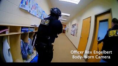 Officers search near the school's entrance. Metro Nashville Police Department / EPA